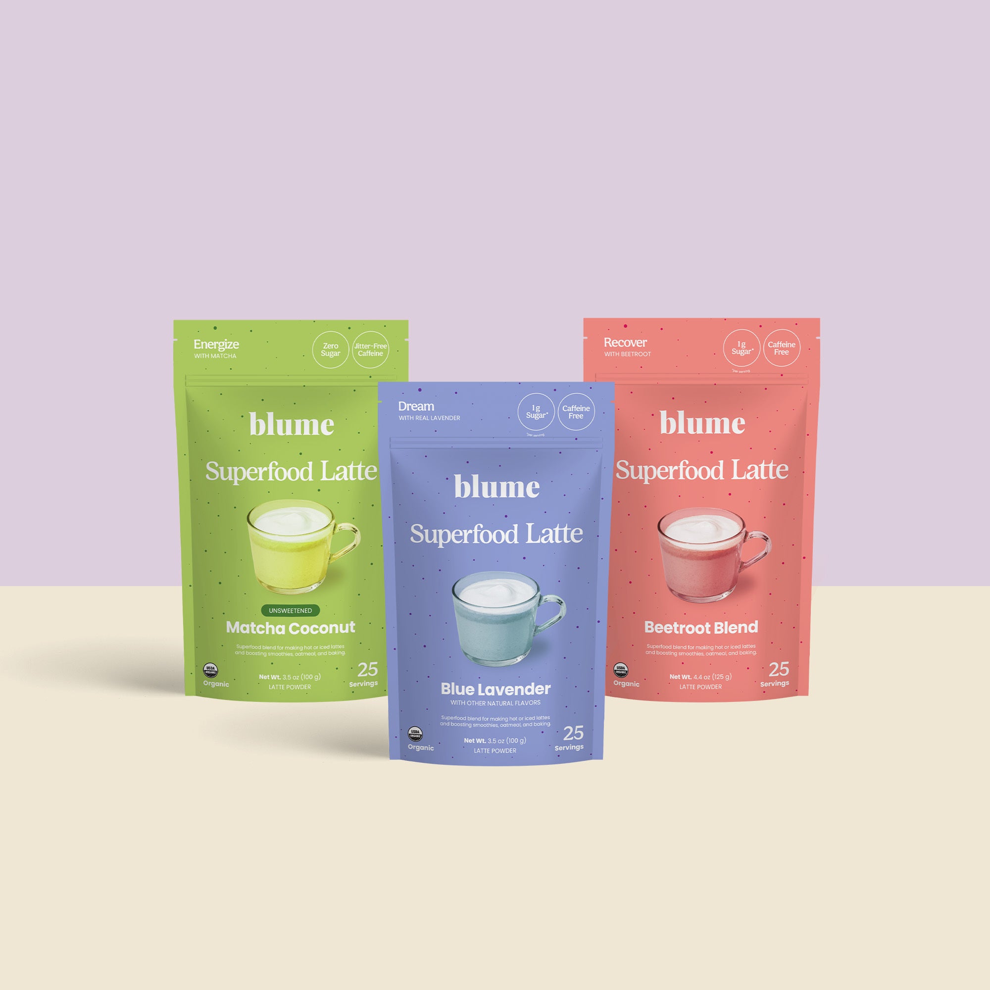 Blumes The All Day Bundle features three vibrant superfood latte packages: green for Matcha Coconut, purple for Blue Lavender, and red for Beetroot Blend, each decorated with a latte cup illustration matching the package color.